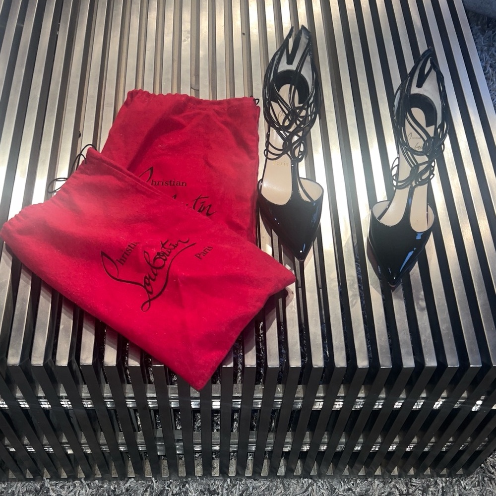 Patent leather, Christian Louboutin strap heels. Only worn a few of times.